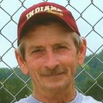 Doug Webb wearing a red hat.